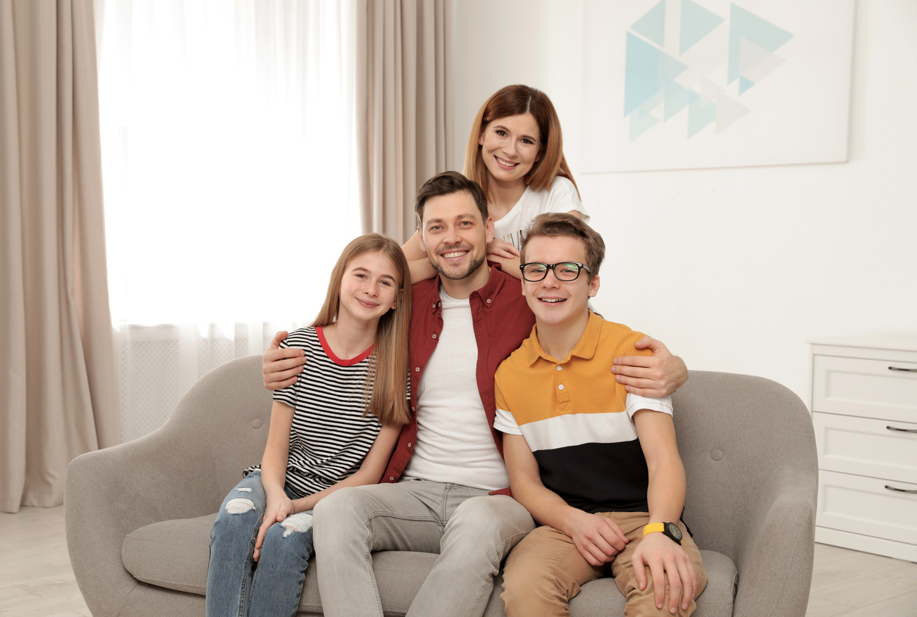 Happy Parents with Their Teenager Children at Home